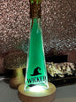 Wicked themed potion. Green dye with gold mica swirls. On a light up base to make a nightlight.